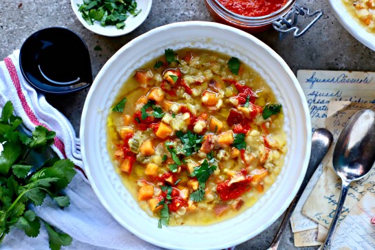 Swirls of homemade piri piri hot sauce top this family-friendly, sweet potato and lentil soup. Vegan, nutritious and perfect for lunch.